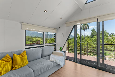 Hillside living room with mountain and garden views